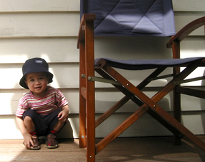 zaki next to chair